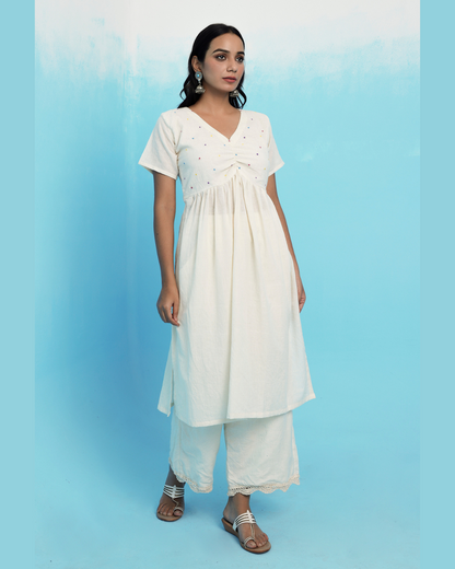 Ecru muslin cotton embroidered kurta set online at bebaakstudio.com