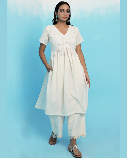 Ecru muslin cotton embroidered kurta set online at bebaakstudio.com