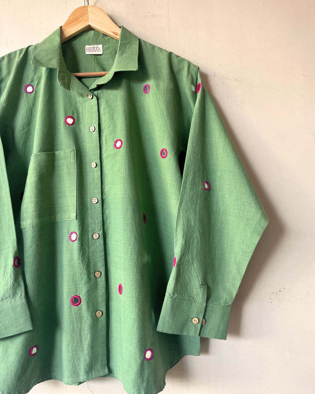 Green shirt with pink mirror work