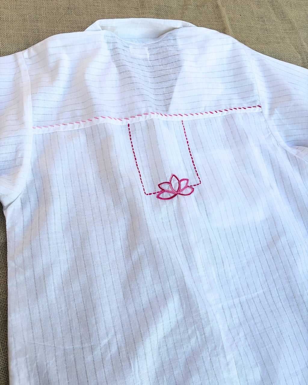 White shirt with lotus embroidery on  back