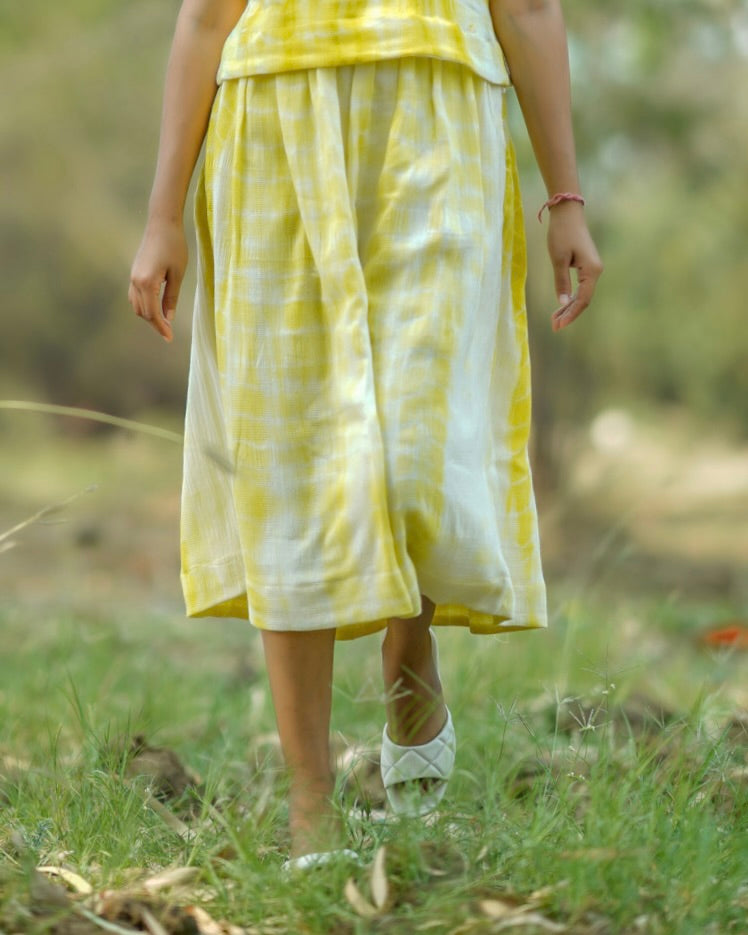 Shop yellow pleat midi skirt from Bebaak