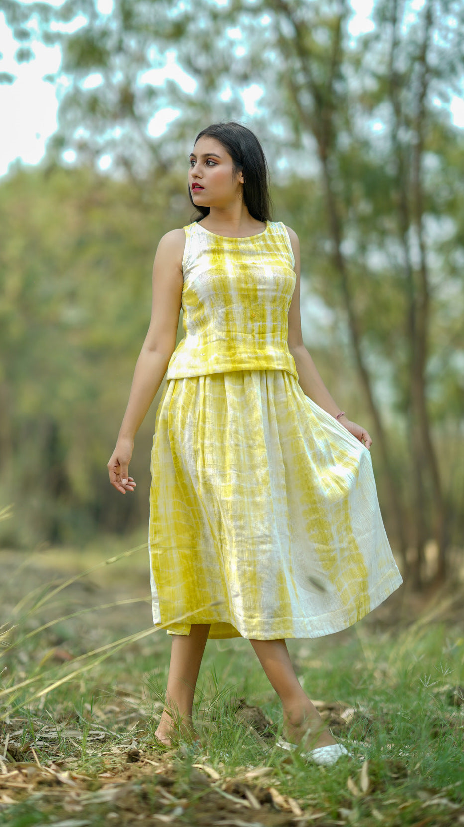 Shop yellow pleat midi skirt from Bebaak