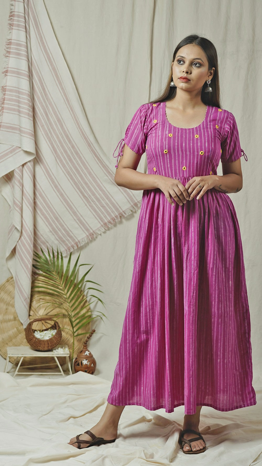 Pink block print maxi dress with knotted sleeves online at bebaakstudio.com